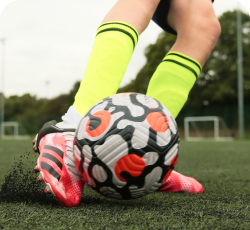 a soccer player passing the ball
